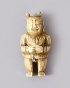 A GOOD EARLY CHINESE CARVED IVORY FIGURE OF A SEMI NUDE MAN - the figure stood in traditional