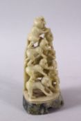 A CHINESE CARVED SOAPSTONE FIGURE OF MONKEYS, the carving depicting ten monkeys climbing, 11cm