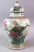 A LARGE 19TH CENTURY CHINESE FAMILLE ROSE PORCELAIN JAR & COVER, decorated with native scenes of