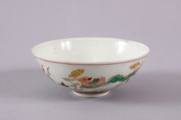 A CHINESE MING STYLE WUCAI PORCELAIN TEA CUP, decorated with scenes of ducks and lotus flowers,