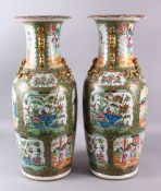 A LARGE PAIR OF 19TH CENTURY CHINESE CANTON FAMILLE ROSE VASES, decorated with larger panels of
