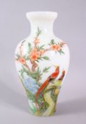 A 19TH CENTURY CHINESE OPAQUE GLASS VASE, painted with birds in a tree, signed, 21cm high.