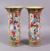 A PAIR OF CHINESE CANTON FAMMILE ROSE PORCELAIN SLEEVE VASES, with panel decoration of figures
