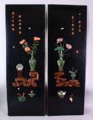 A PAIR OF CHINESE LACQUERED PANELS with hardstone urns and flowers, 96cm x 33cm.