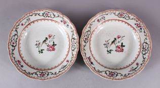 A PAIR OF OF 18TH CENTURY CHINESE EXPORT FAMILLE ROSE DISHES, the centre with a bird and floral