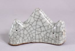 A CHINESE CRACKLE GLAZED BRUSH REST, 10cm wide