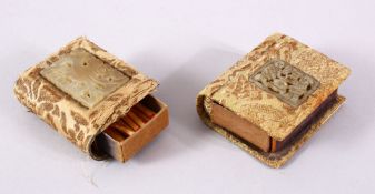 TWO CHINESE CARVED JADE INSET MATCH BOX HOLDERS, each inset with a small carved jade pendant, two