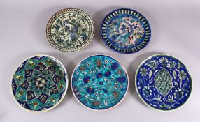 A COLLECTION OF 5 JERUSALEM PALESTINIAN POTTERY PLATES, each with varying decoration of flora and