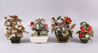 A MIXED LOT OF FOUR CHINESE CARVED JADE BONSAI / TREES, One of a peach tree, the other with native