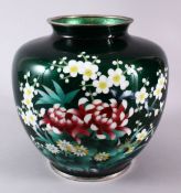 A JAPANESE TAISHO / SHOWA PERIOD GREEN GINBARI CLOISONNE VASE, with a foil ground and blossom &