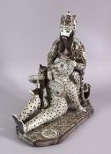 A RARE & UNUSUAL SIGNED 19TH CENTURY PERSIAN QAJAR GLAZED POTTERY FIGURE OF RUSTAN SLAYING THE WHITE