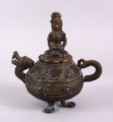 AN EARLY CHINESE OR SOUTH EAST ASIAN BRONZE LIDDED OIL LAMP, overall height 13cm, width 12cm.