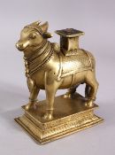 A 19TH CENTURY SOUTH INDIAN BRASS FIGURE OF NANDI BULL, 17cm high, 14cm long.
