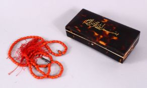 A SET OF CARVED CORAL RELIGEOUS PRAYER BEAD & INLAID IVORY TORTOISESHELL BOX, the red coral prayer