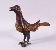 A PERSIAN QAJAR GOLD DAMASCENED IRON MODEL OF A BIRD, 15.5cm high x 18cm long.