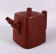 A CHINESE YIXING CLAY TEAPOT, of square / rectangular form, the body with carved calligraphy, the