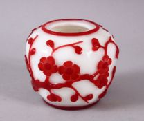 A CHINESE PEKING GLASS OVERLAID BRUSH WASH, the white body with overlaid ruby red floral decoration,