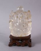 AN INDIAN CARVED ROCK CRYSTAL FIGURE OF GANESH - In a seated meditative pose, 7cm high