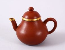 A CHINESE YIXING CLAY & GOLD METAL MOUNTED TEAPOT & COVER, the body mounted with gold coloured