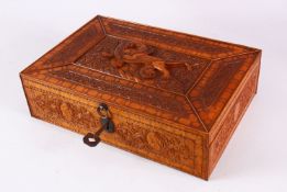 A FINE 19TH CENTURY PERSIAN QAJAR ENGRAVED WOODEN BOX, carved with scenes of mythical beasts and