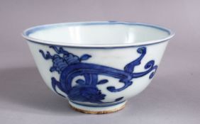 A CHINESE BLUE & WHITE PORCELAIN BOWL, with mythical beast decoration and a mar to base, 12cm