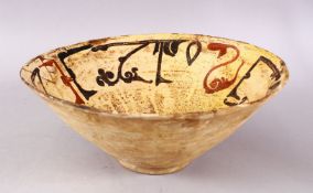 A GOOD IRAN STYLE POTTERY BOWL, decorated with a beige ground and kufic script decoration, 30cm (