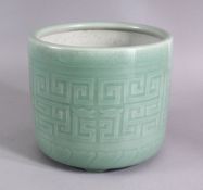 A CHINESE CELADON KEY PATTERN TRIPLE FOOT PLANTER, the body carved with celadon key and chilong