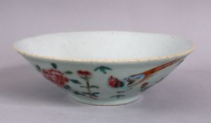 A CHINESE CELADON FAMILLE ROSE PORCELAIN BOWL, decorated with a celadon ground and butterflies,