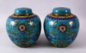 A PAIR OF 19TH / 20TH CENTURY CHINESE CLOISONNE GINGER JARS AND COVERS, the blue ground decorated