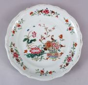 AN 18TH CENTURY CHINESE FAMILLE ROSE PORCELAIN PLATE, decorated with native floral decoration, 25cm