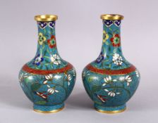 A PAIR OF 19TH / 20TH CENTURY CHINESE CLOISONNE VASES, with a turquoise ground and floral