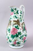 A LARGE CHINESE JUG, painted with dragon and flowers, 35cm high.