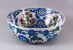 A LARGE 19TH CENTURY ITALIAN CANTAGALI IZNIK STYLE POTTERY BOWL, the bowl well decorated with native