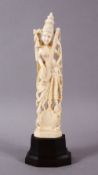 A 19TH CENTURY INDIAN CARVED IVORY FIGURE OF SARASWATI, 19cm high.