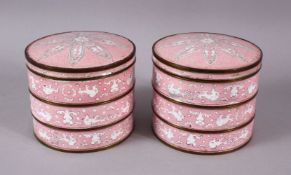A PAIR OF CHINESE ENAMEL CYLINDRICAL SECTIONAL BOXES, with a pink ground and floral pattern, each