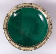 AN EARLY EASTERN GREEN GLAZED & WHITE METAL LARGE POTTERY DISH, the large dish glazed with a green