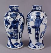 A PAIR OF 19TH CENTURY CHINESE BLUE AND WHITE PRUNUS VASES, painted with precious objects, four