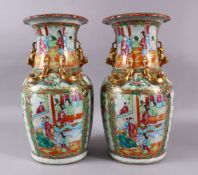 A PAIR OF 19TH CENTURY CHINESE CANTON FAMILLE ROSE PORCELAIN VASES, each with panel decoration of
