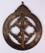 AN ISLAMIC CHASED COMPASS, with chased calligraphy and symbols and a revolving hand, 36cm widest