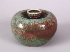 A CHINESE APPLE GREEN & COPPER RED PORCELIAN BRUSH WASH, with a graduating glaze and a six character