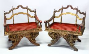 A PAIR OF 19TH/20TH CENTURY THAI CARVED HOWDAH ELEPHANT CHAIRS, profusely carved and pierced with