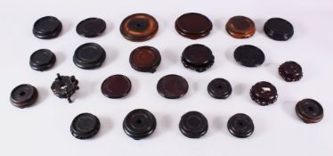 A MIXED LOT OF 24 CHINESE CARVED HARDWOOD STANDS - each of varying size, style and timber, the