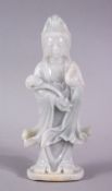 A CHINESE CARVED JADEITE FIGURE OF GUANYIN / DEITY , stood holding a ruyi and with one hand aloft