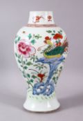 AN 18TH CENTURY YONGZHENG PERIOD FAMILLE ROSE/VERTE VASE, painted with flowers and phoenix, 25cm