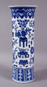 A GOOD 19TH CENTURY CHINESE BLUE AND WHITE SLEEVE VASE, painted with precious objects, 30cm high.