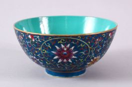 A CHINESE POLY CHROME GLAZED LOTUS PATTERN BOWL, the interior with turquoise ground, yungtchen