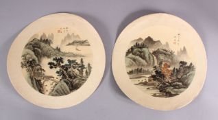 A PAIR OF CHINESE CICULAR PAINTINGS ON TEXTILE - each depicting a native landscape view, 30cm
