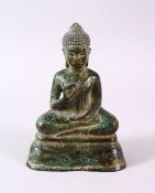 A CHINESE BRONZE FIGURE OF BUDDHA, in a seated position upon lotus, 11.5cm high