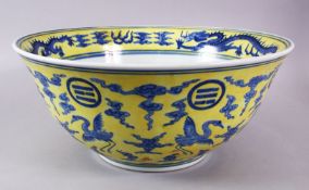 A LARGE CHINESE YELLOW & BLUE PORCELAIN DRAGON BASIN, with a yellow wash ground with a central