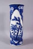 A 19TH CENTURY CHINESE BLUE AND WHITE PRUNUS SLEEVE VASE, painted with panels of a bird and peony,